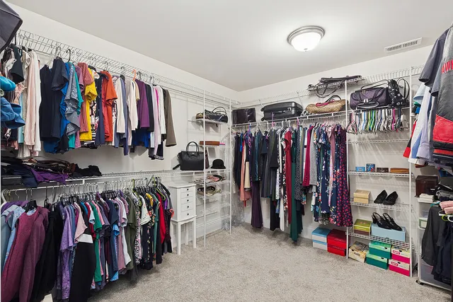 a bathroom with a double vanity sink toilet mirror and bathtub