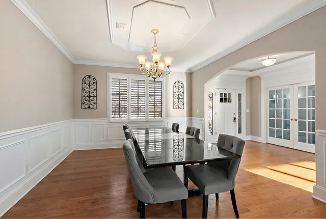 a spacious bedroom with a bed and a window