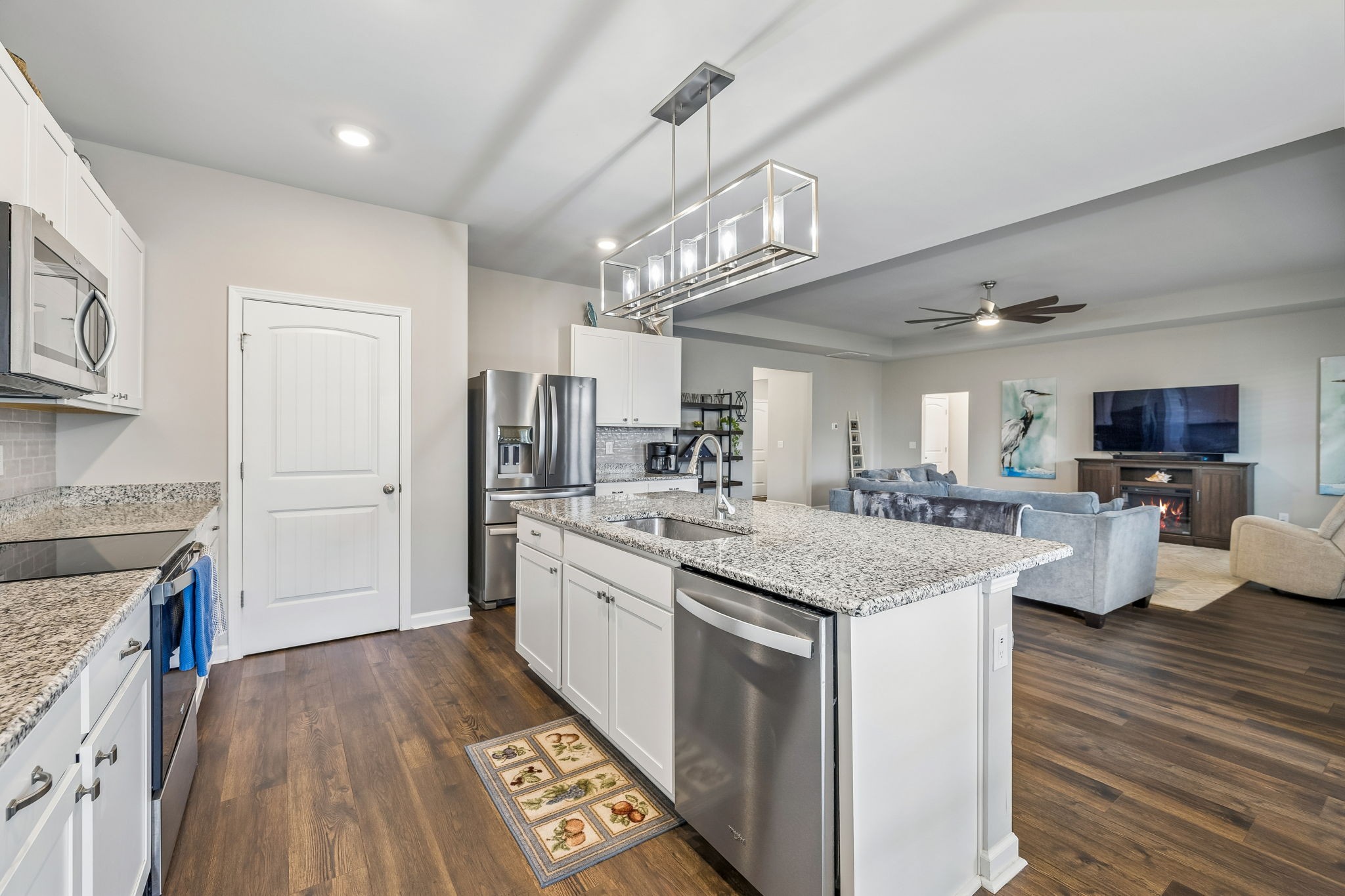 1426 Marigold Drive Spring Hill, TN 37174 - Photo 22 of 65 a kitchen with stainless steel appliances granite countertop a sink stove and refrigerator
