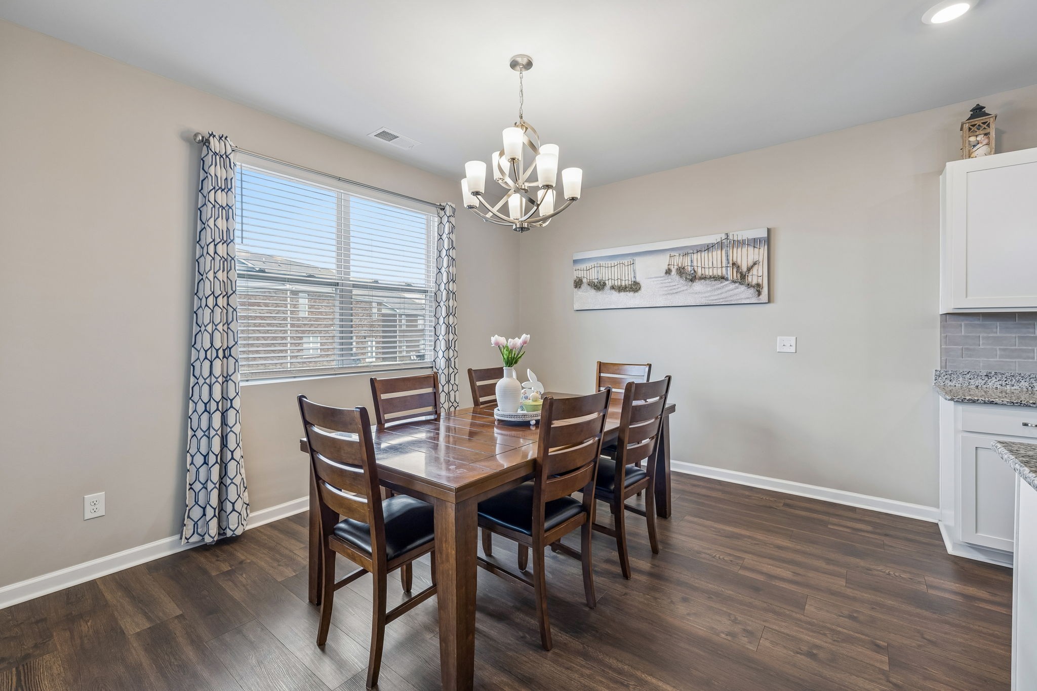 1426 Marigold Drive Spring Hill, TN 37174 - Photo 28 of 65 a view of a dining room with furniture a chandelier and wooden floor
