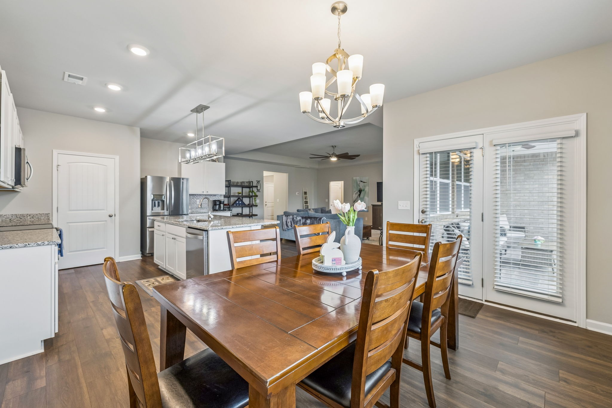 1426 Marigold Drive Spring Hill, TN 37174 - Photo 30 of 65 a view of a dining room with furniture and wooden floor