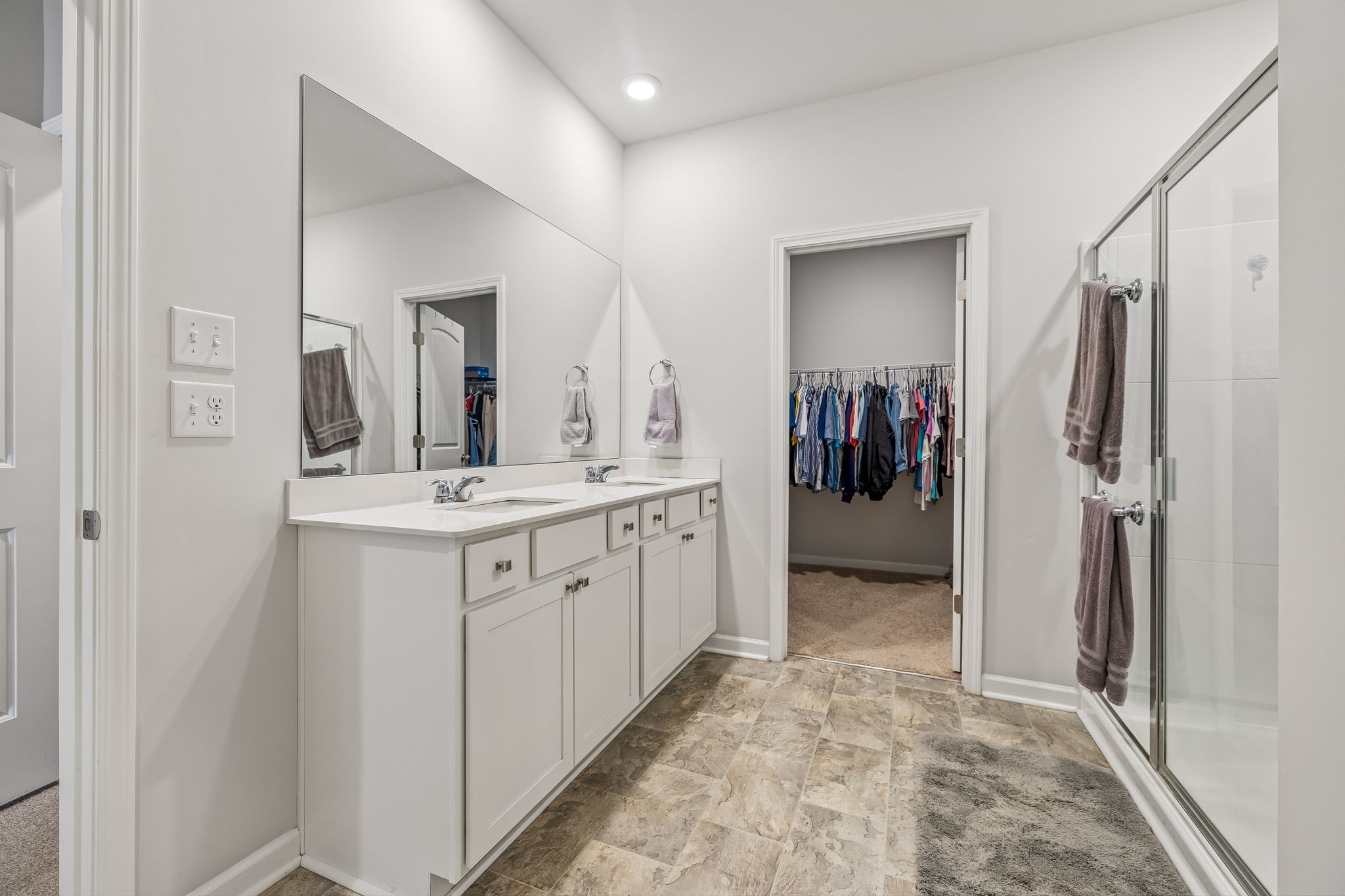 1426 Marigold Drive Spring Hill, TN 37174 - Photo 45 of 65 a bathroom with a double vanity sink and a mirror