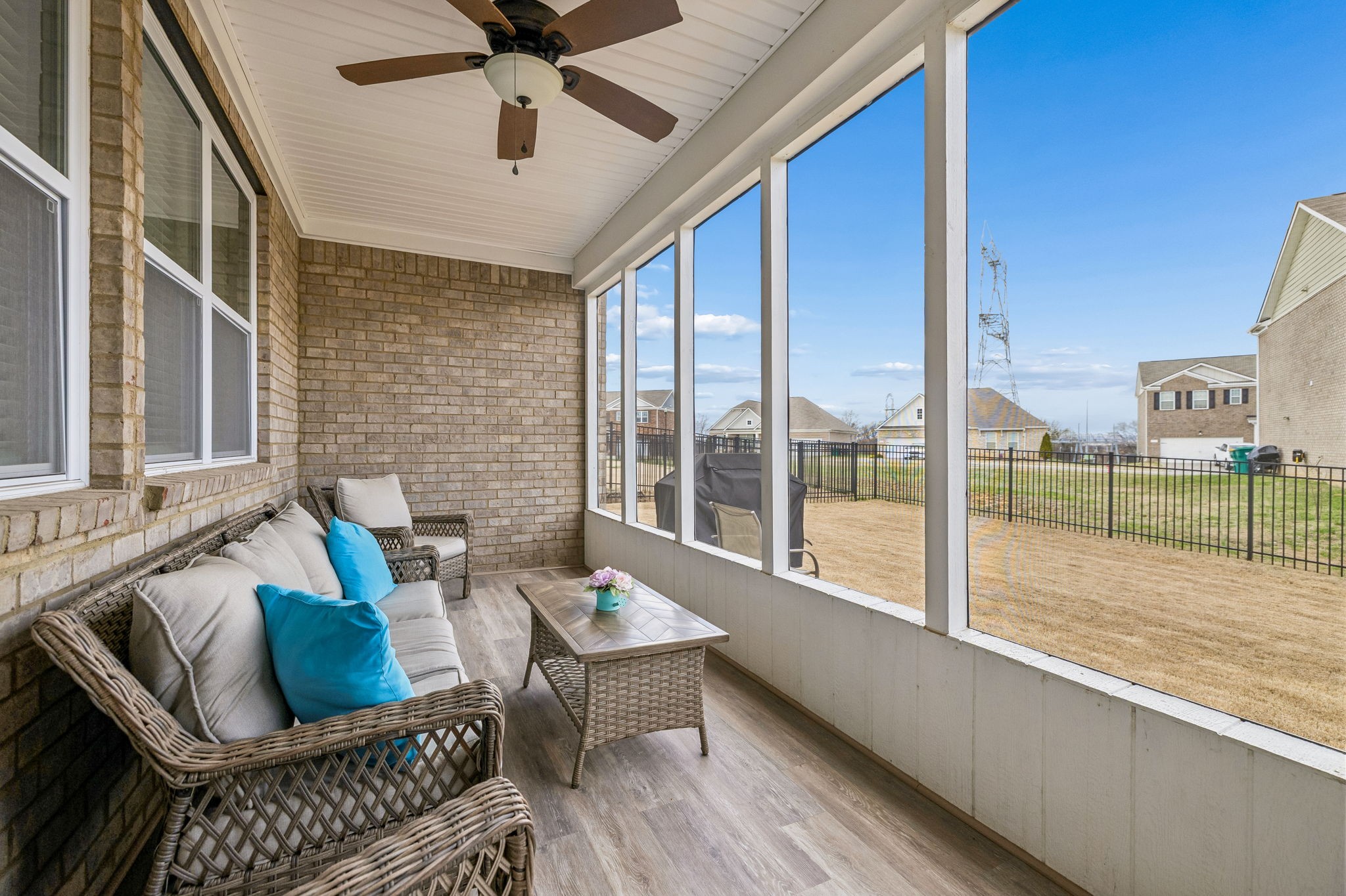 1426 Marigold Drive Spring Hill, TN 37174 - Photo 52 of 65 a living room with furniture and a floor to ceiling window