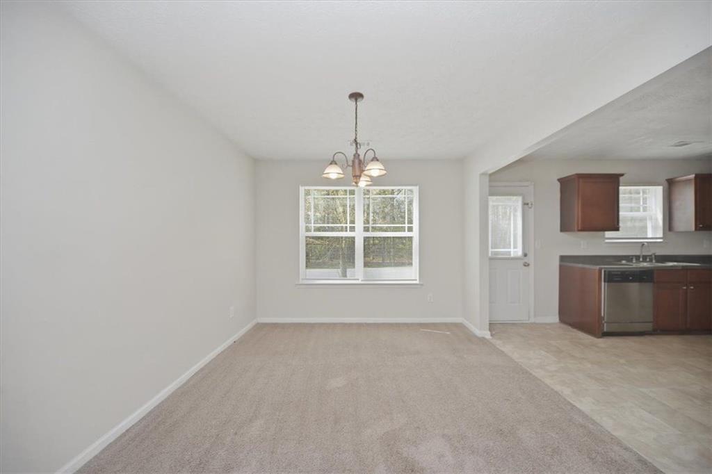 100 Wexford Way Covington, GA 30014 - Photo 11 of 37 a view of an empty room with a window