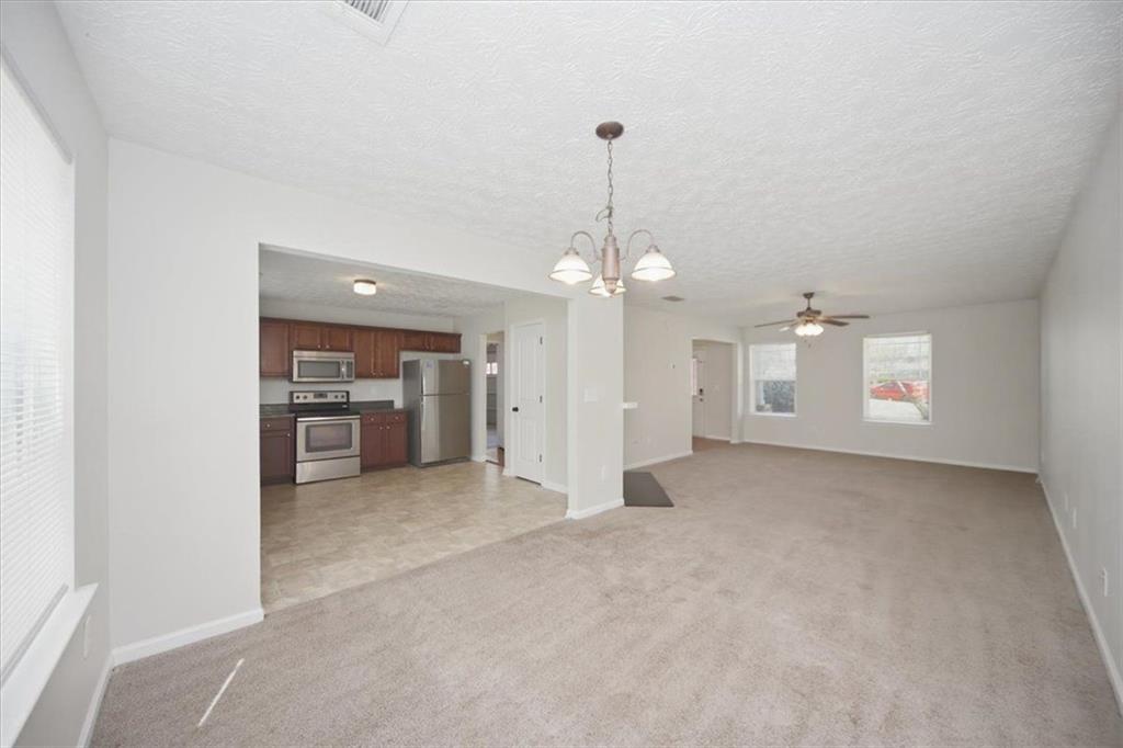 100 Wexford Way Covington, GA 30014 - Photo 12 of 37 a view of a livingroom with a chandelier