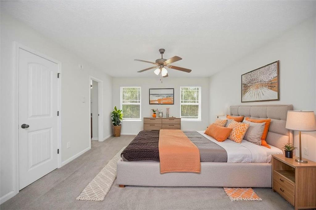 100 Wexford Way Covington, GA 30014 - Photo 19 of 37 a living room with furniture ceiling fan and a rug