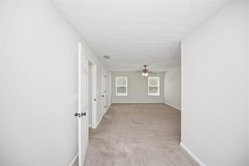 100 Wexford Way Covington, GA 30014 - Photo 23 of 37 an empty room with windows