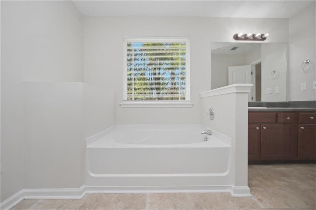 100 Wexford Way Covington, GA 30014 - Photo 25 of 37 a bathroom with a bathtub