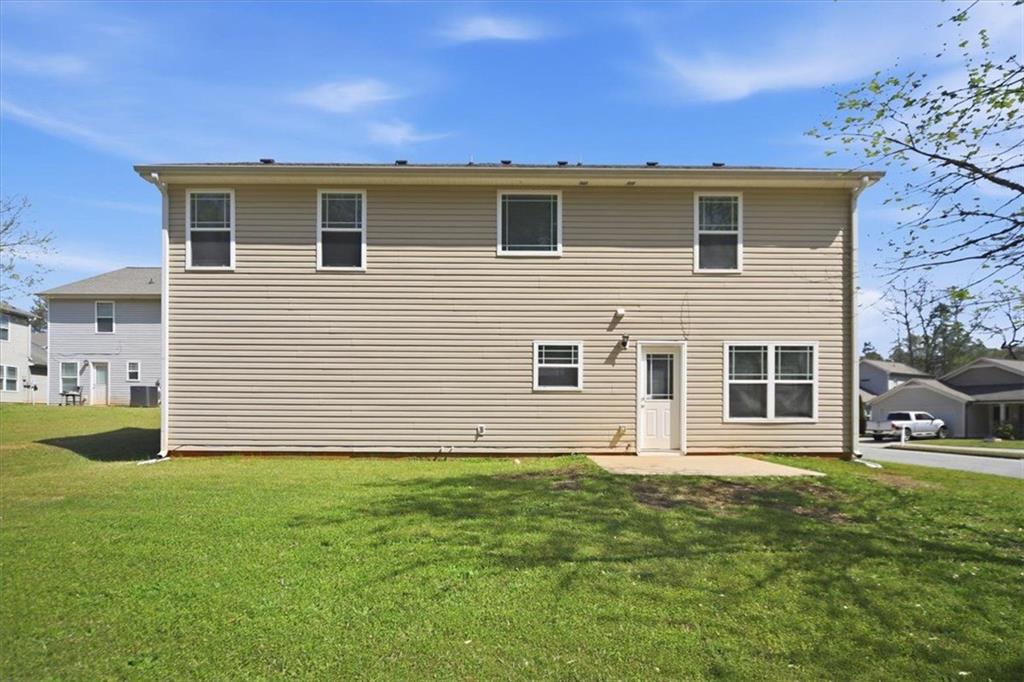 100 Wexford Way Covington, GA 30014 - Photo 34 of 37 a front view of a house with a yard