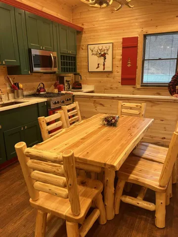 a balcony with table and chairs