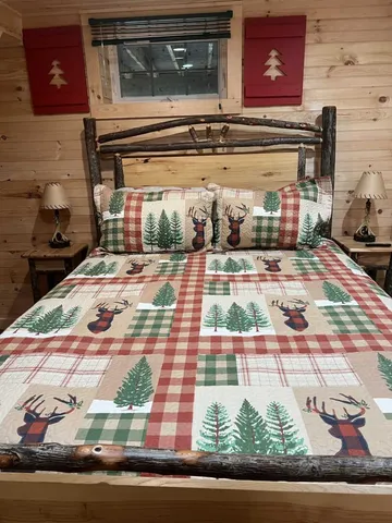 a bed sitting in a kitchen next to a window