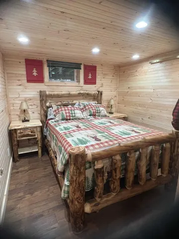 a bedroom with a bed and a dresser
