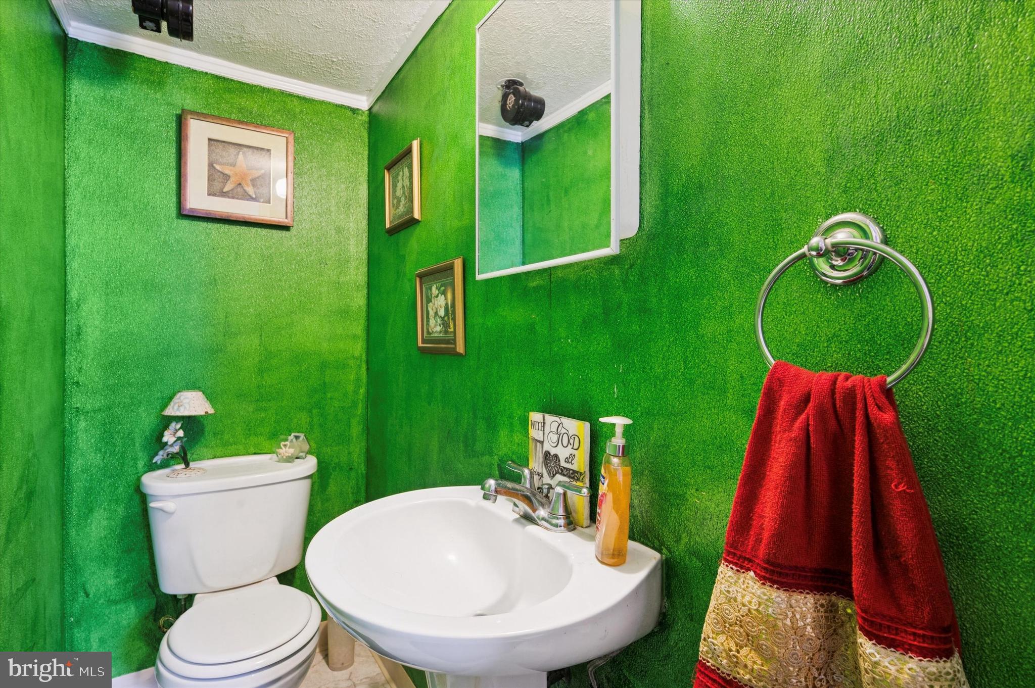 153 Ervin Avenue Marcus Hook, PA 19061 - Photo 11 of 15 a bathroom with a toilet and a sink