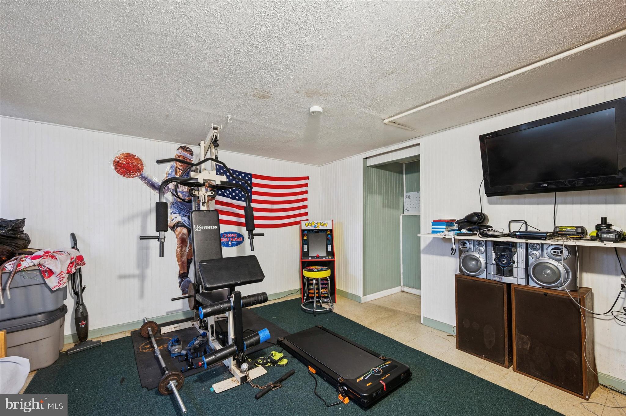 153 Ervin Avenue Marcus Hook, PA 19061 - Photo 12 of 15 a living room with furniture and a flat screen tv