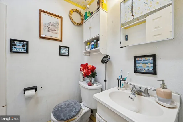 a bathroom with a sink mirror and vanity
