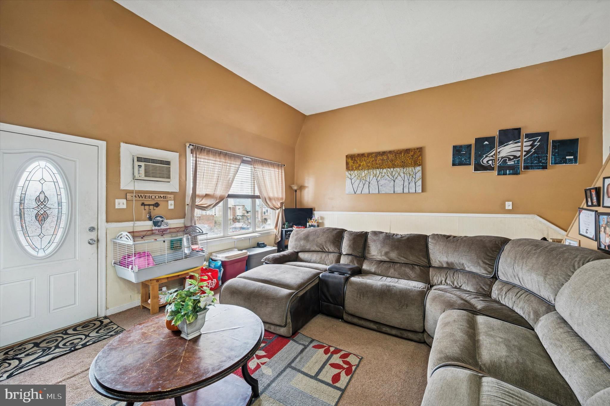 153 Ervin Avenue Marcus Hook, PA 19061 - Photo 2 of 15 a living room with furniture and a large window