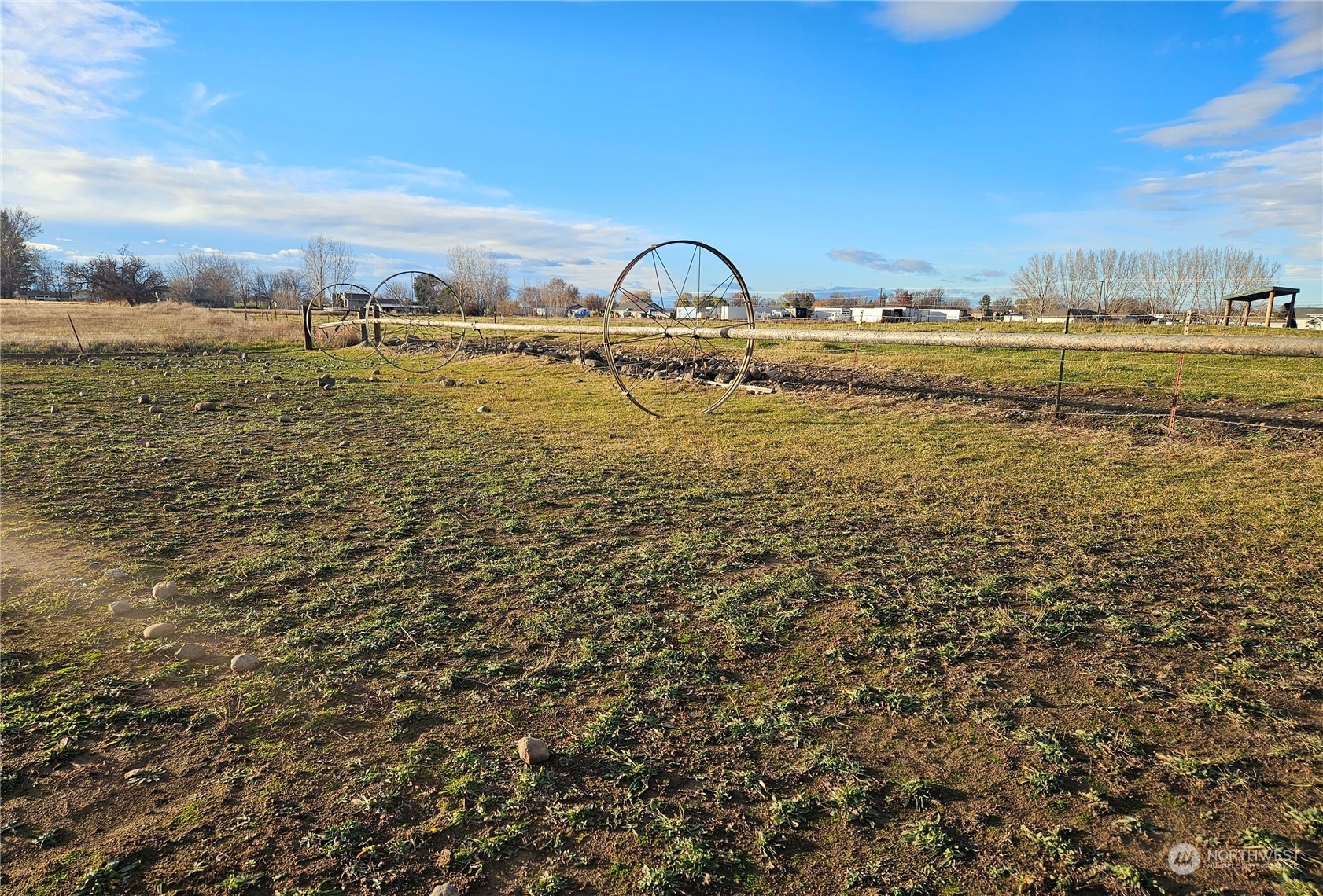 8100 South Webb Road Prosser, WA 99350 - Photo 3 of 14 a view of a lake with a building in the background