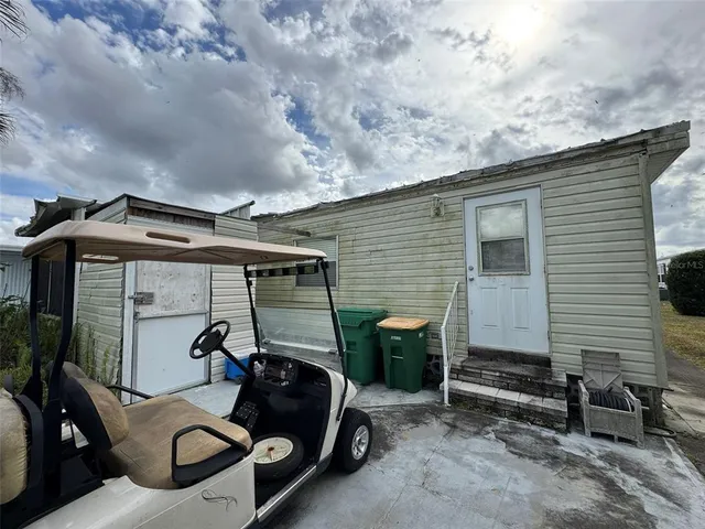a view of a car park in front of house