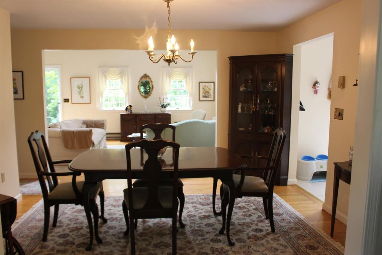40 Lighthouse Lane Eastham, MA 02642 - Photo 12 of 33 a view of a dining room with furniture and chandelier