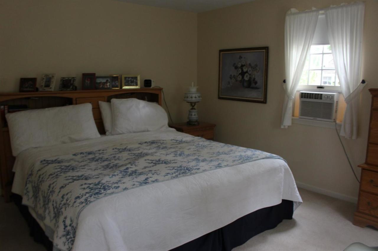 40 Lighthouse Lane Eastham, MA 02642 - Photo 17 of 33 a bedroom with a bed and a window
