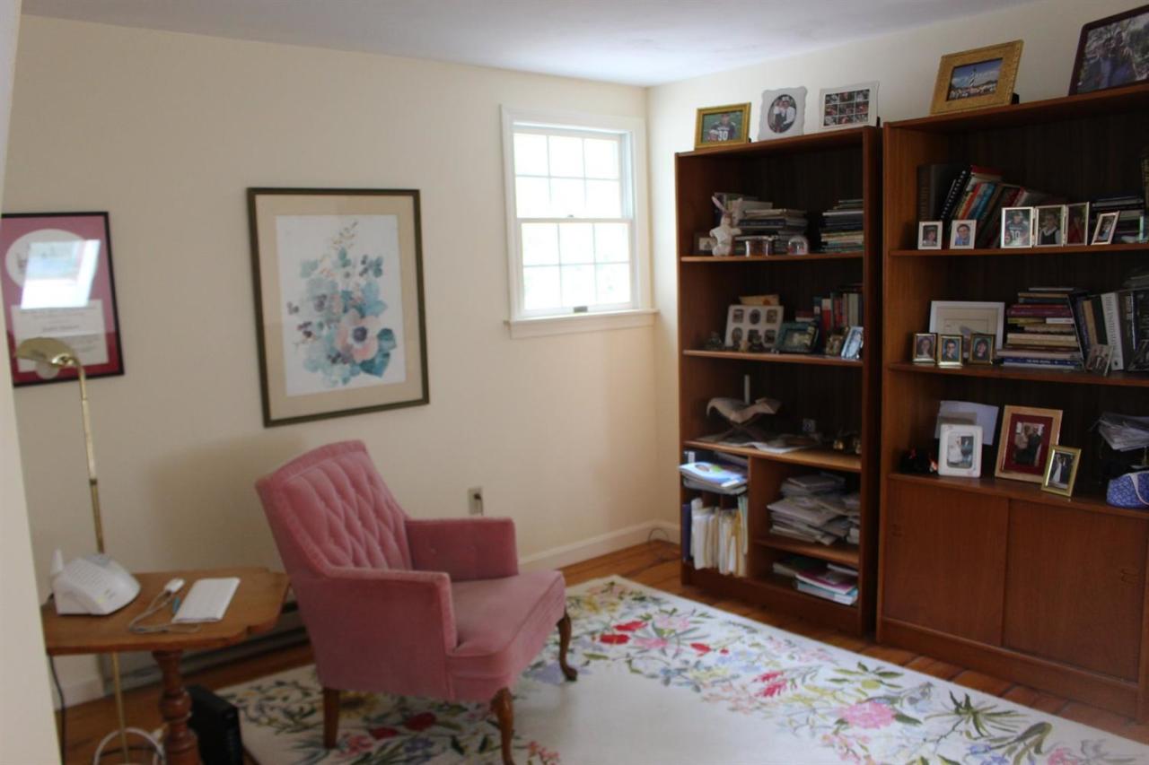 40 Lighthouse Lane Eastham, MA 02642 - Photo 21 of 33 a living room with furniture cabinets and book shelf