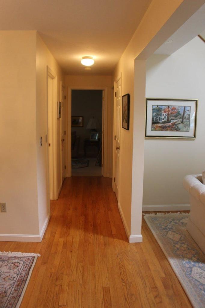 40 Lighthouse Lane Eastham, MA 02642 - Photo 26 of 33 a view of a hallway with wooden floor and staircase