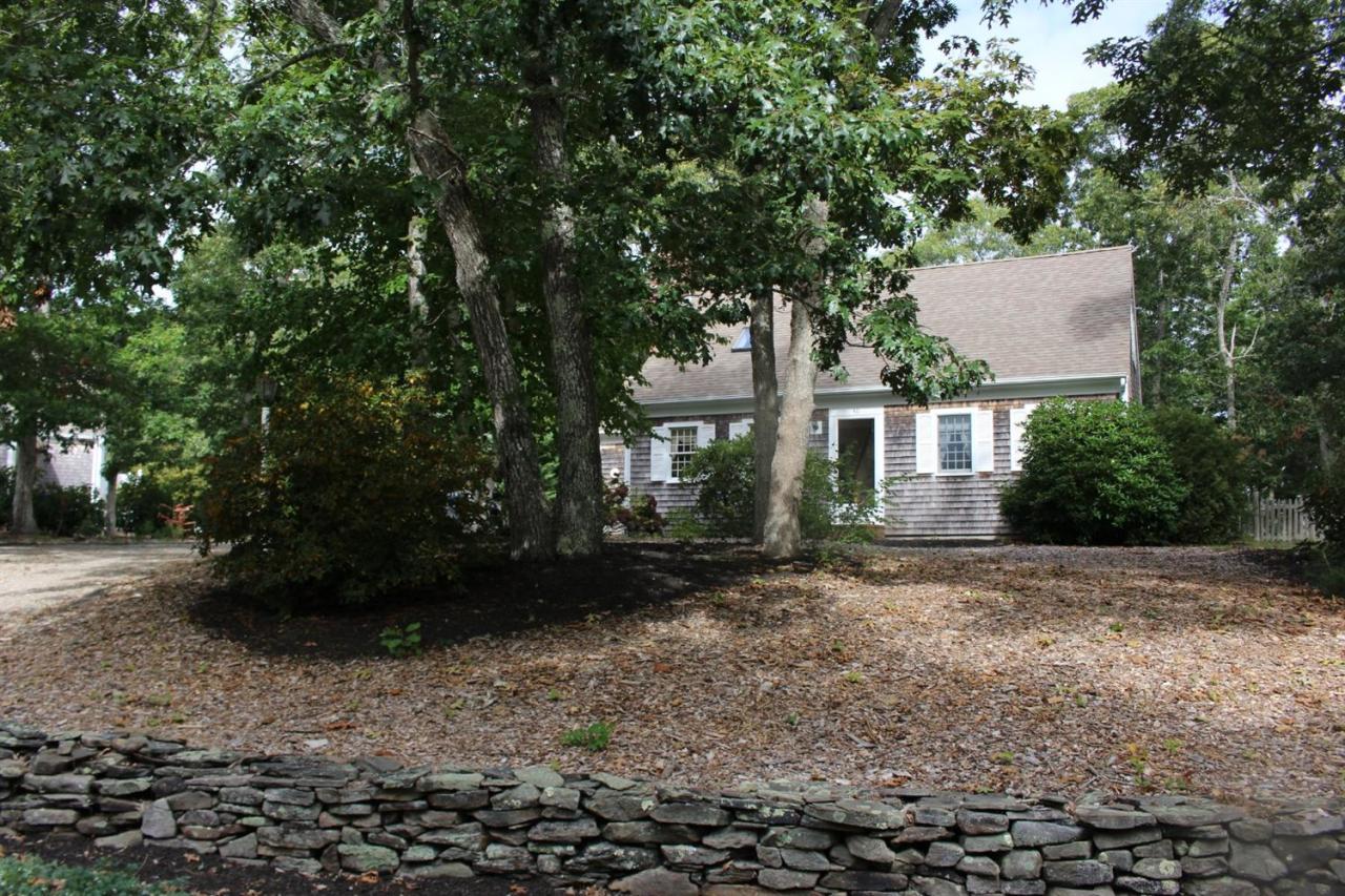 40 Lighthouse Lane Eastham, MA 02642 - Photo 29 of 33 a view of a house with a yard