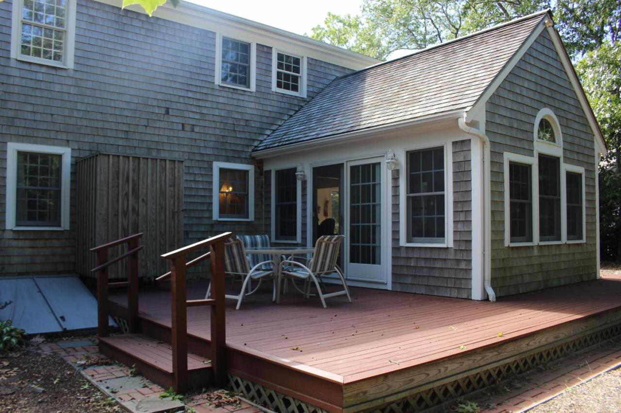 40 Lighthouse Lane Eastham, MA 02642 - Photo 3 of 33 a patio with table and chairs