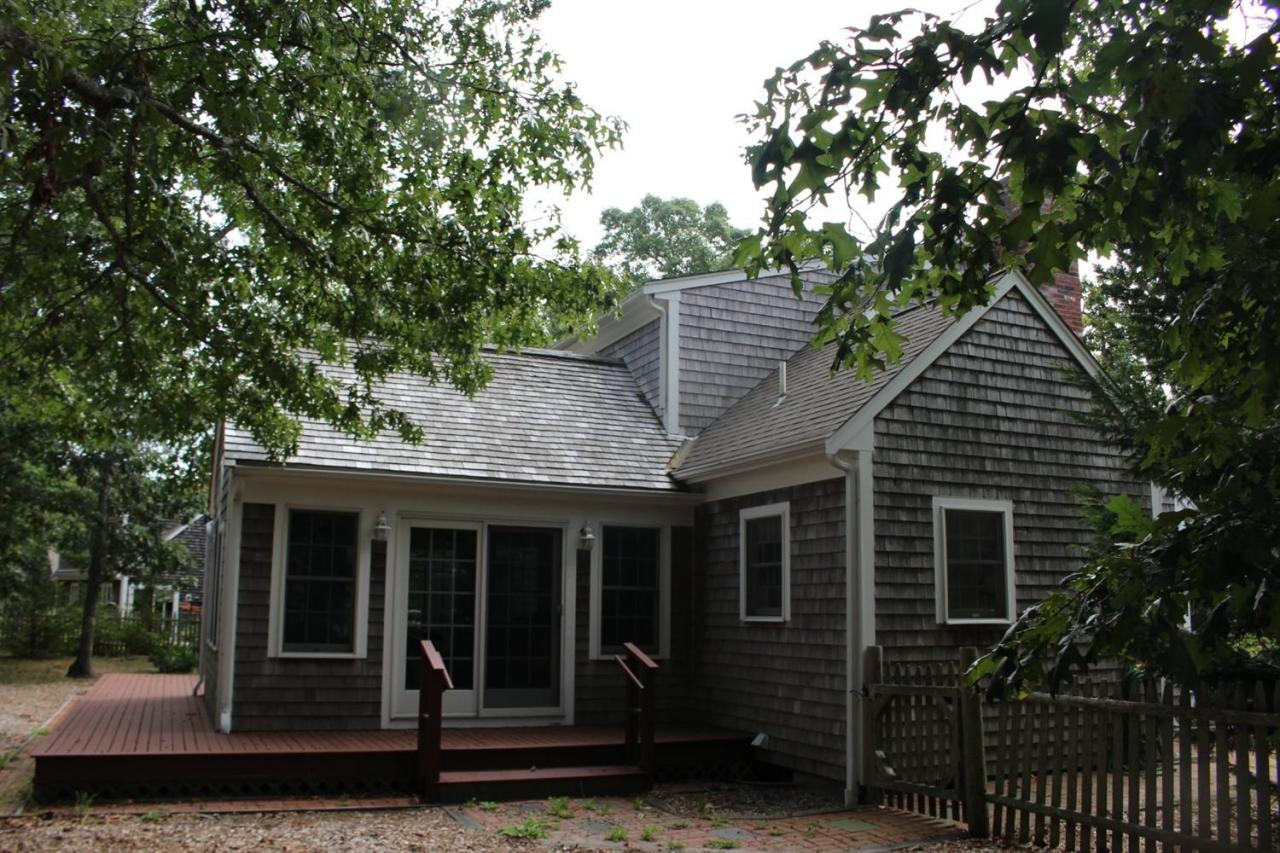 40 Lighthouse Lane Eastham, MA 02642 - Photo 4 of 33 a front view of a house with garden