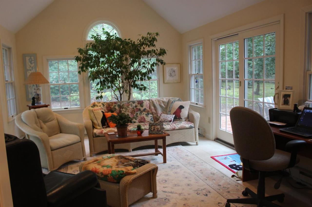 40 Lighthouse Lane Eastham, MA 02642 - Photo 6 of 33 a living room with furniture and a large window