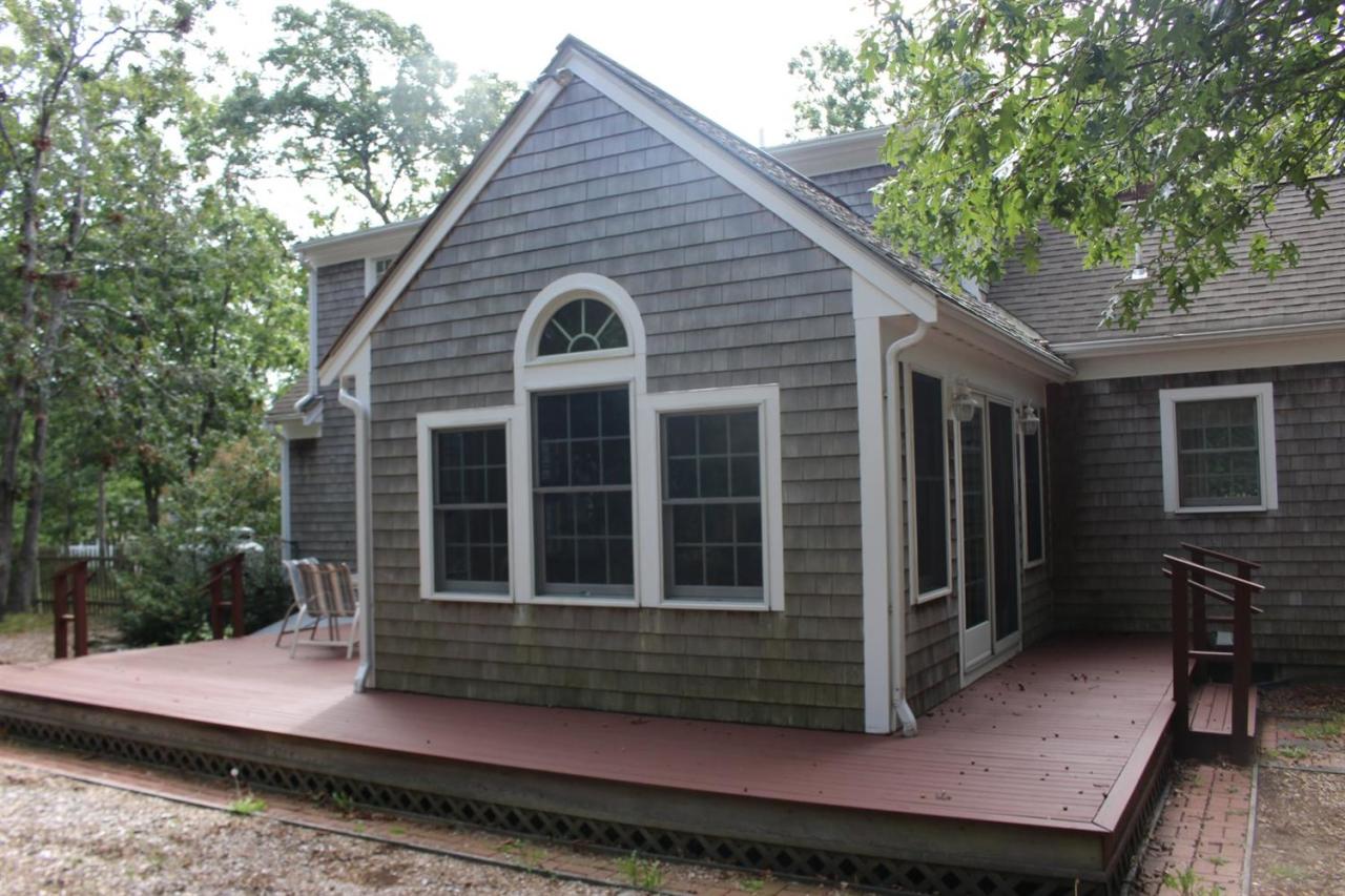 40 Lighthouse Lane Eastham, MA 02642 - Photo 7 of 33 a front view of a house with entryway