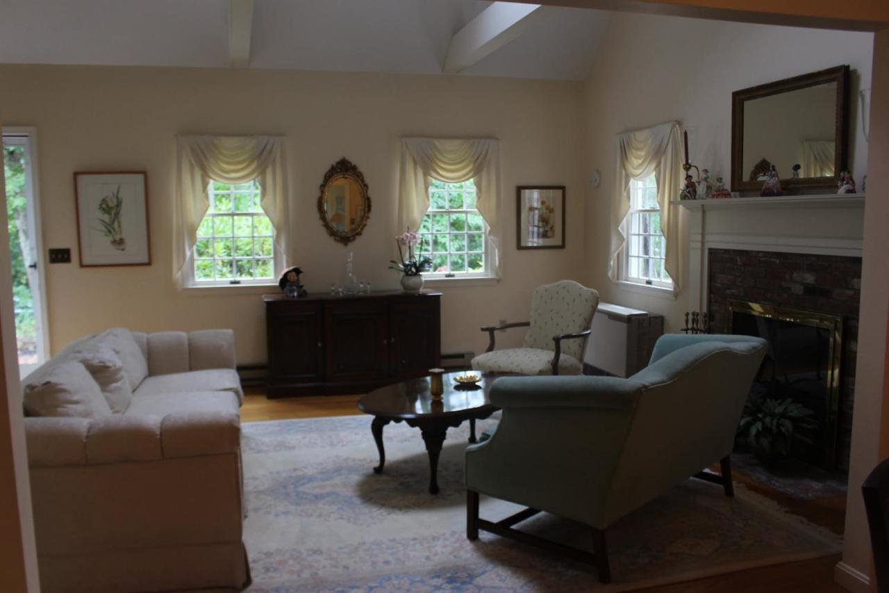 40 Lighthouse Lane Eastham, MA 02642 - Photo 9 of 33 a living room with furniture fireplace and window
