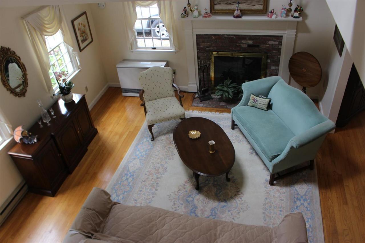 40 Lighthouse Lane Eastham, MA 02642 - Photo 10 of 33 a living room with furniture and a fireplace