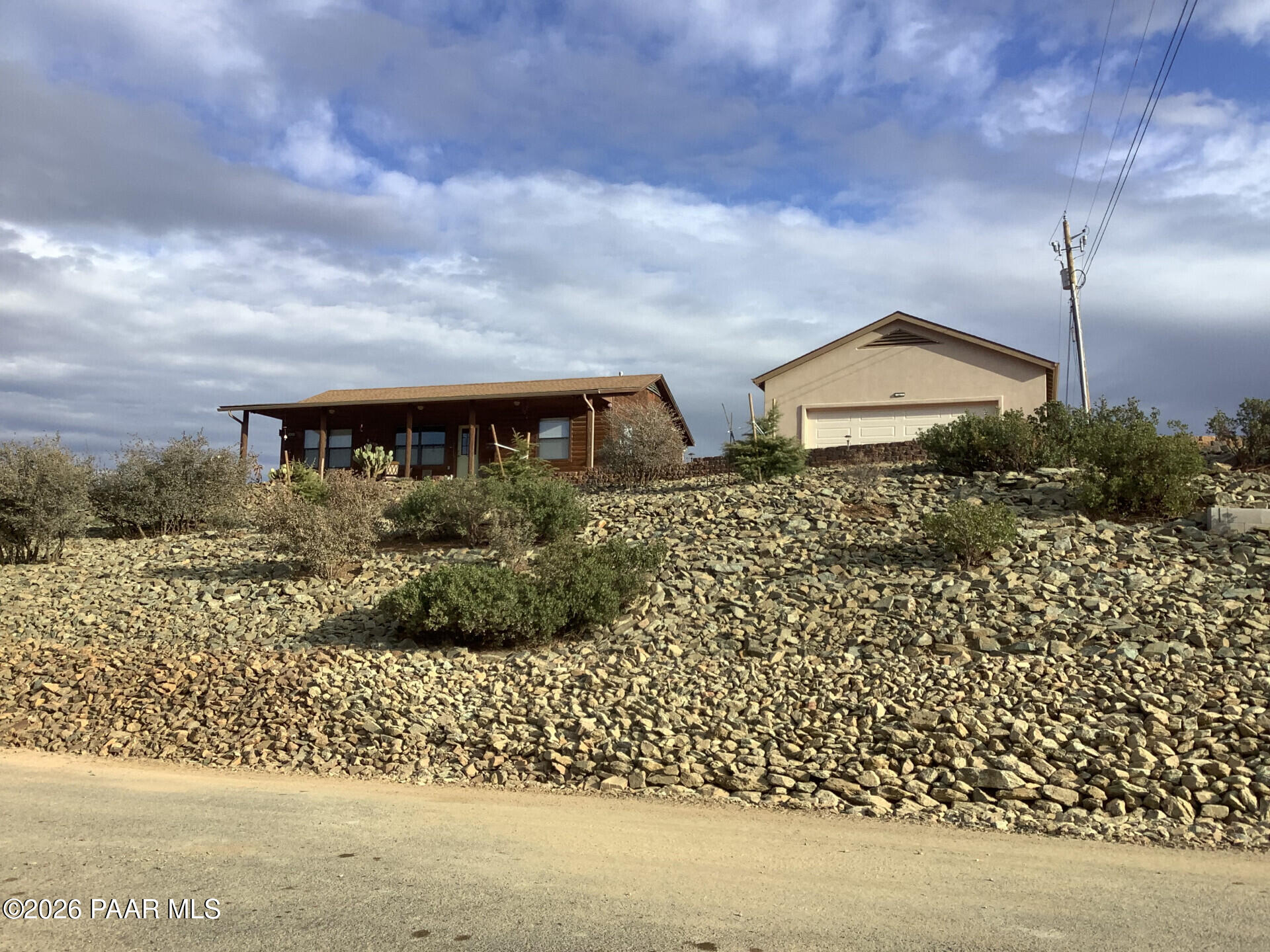 14504 East Ridge Way Dewey-Humboldt, AZ 86327 - Photo 16 of 34 a view of a house with a yard and wooden fence