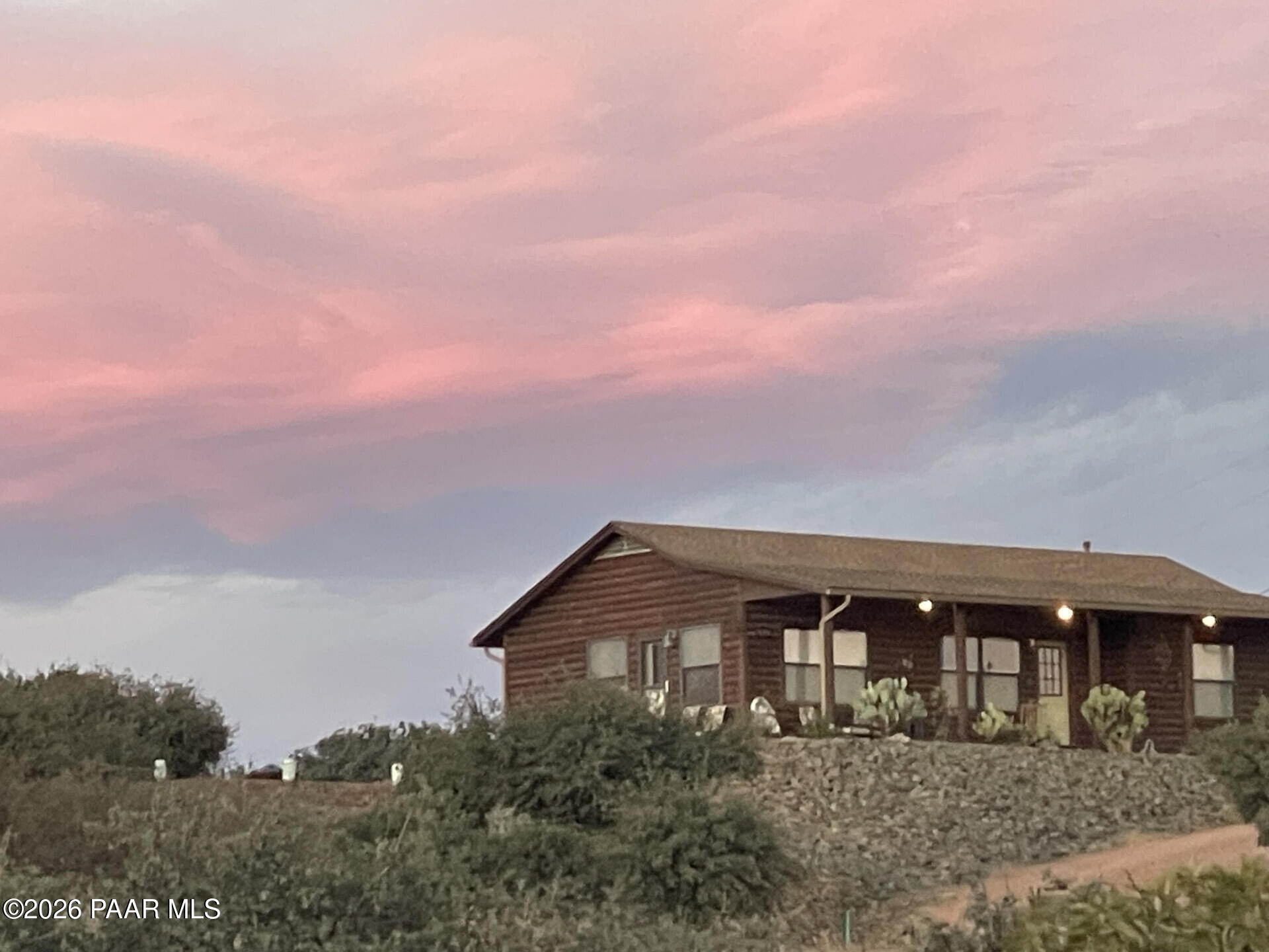 14504 East Ridge Way Dewey-Humboldt, AZ 86327 - Photo 2 of 34 a front view of a house with a yard