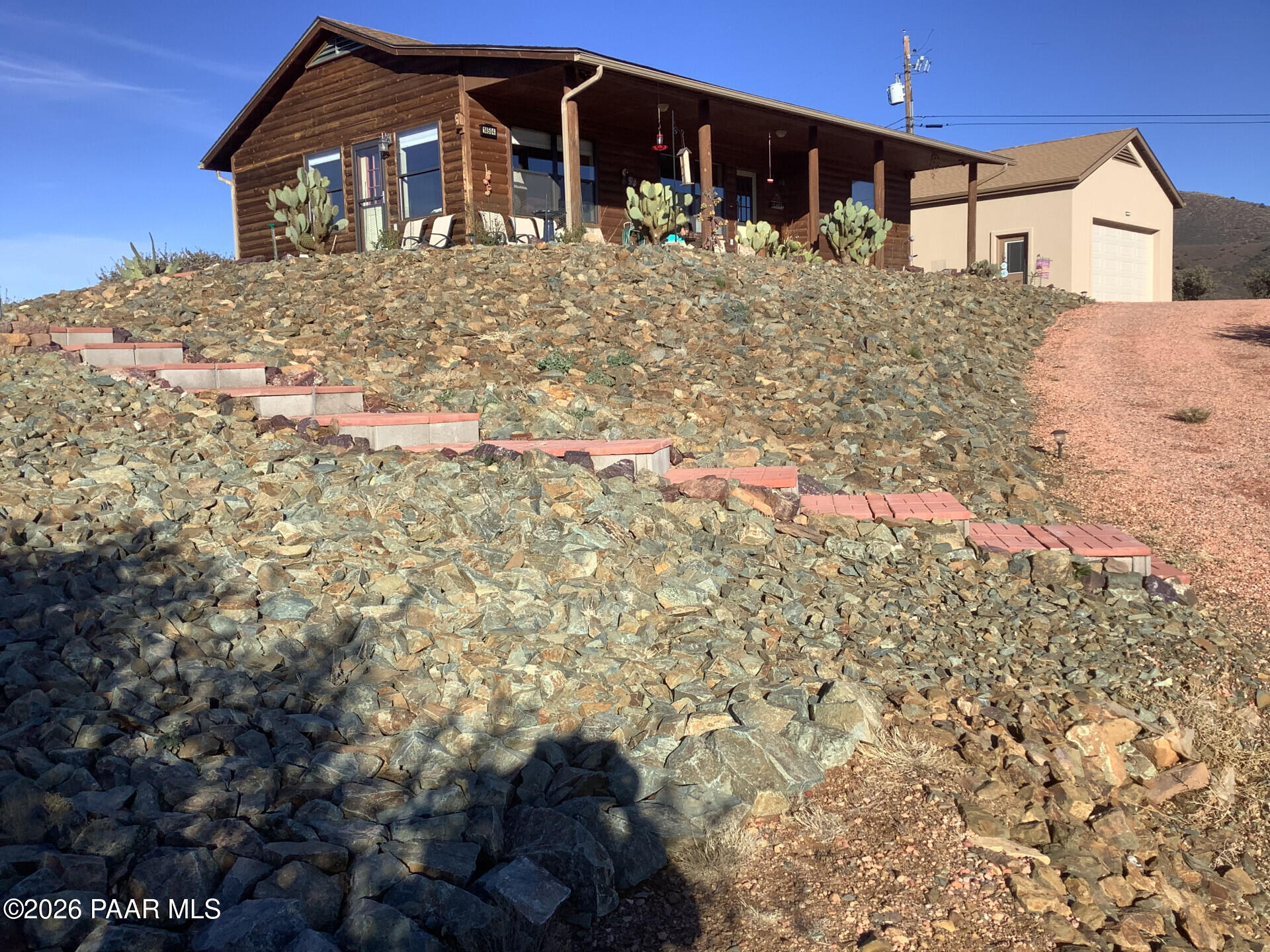 14504 East Ridge Way Dewey-Humboldt, AZ 86327 - Photo 23 of 34 a front view of a house with a yard