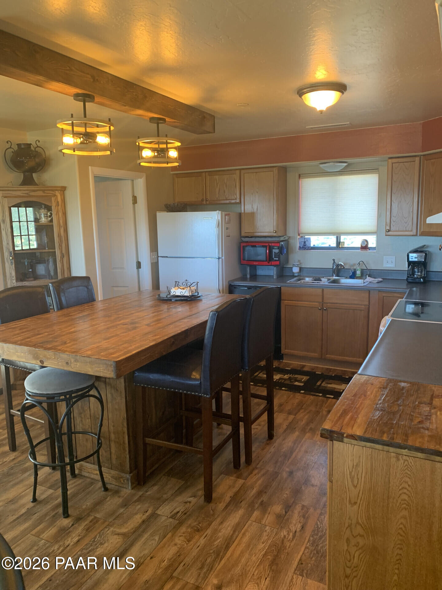 14504 East Ridge Way Dewey-Humboldt, AZ 86327 - Photo 3 of 34 a kitchen with a table and chairs in it