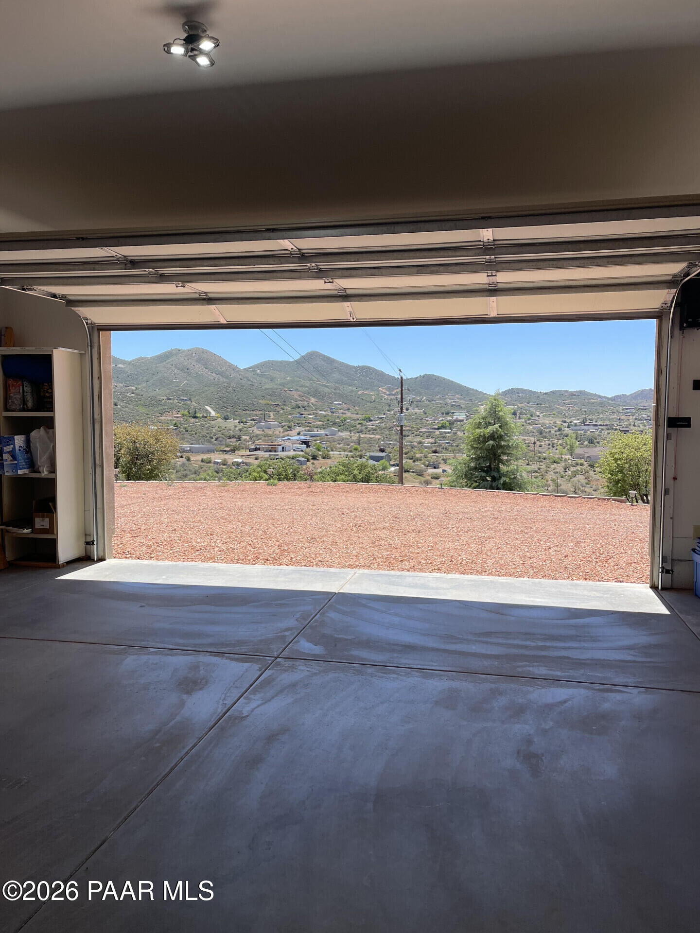 14504 East Ridge Way Dewey-Humboldt, AZ 86327 - Photo 32 of 34 a view of room with wooden floor and a floor to ceiling window
