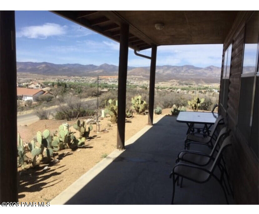 14504 East Ridge Way Dewey-Humboldt, AZ 86327 - Photo 5 of 34 a view of a floor to ceiling window and an ocean view