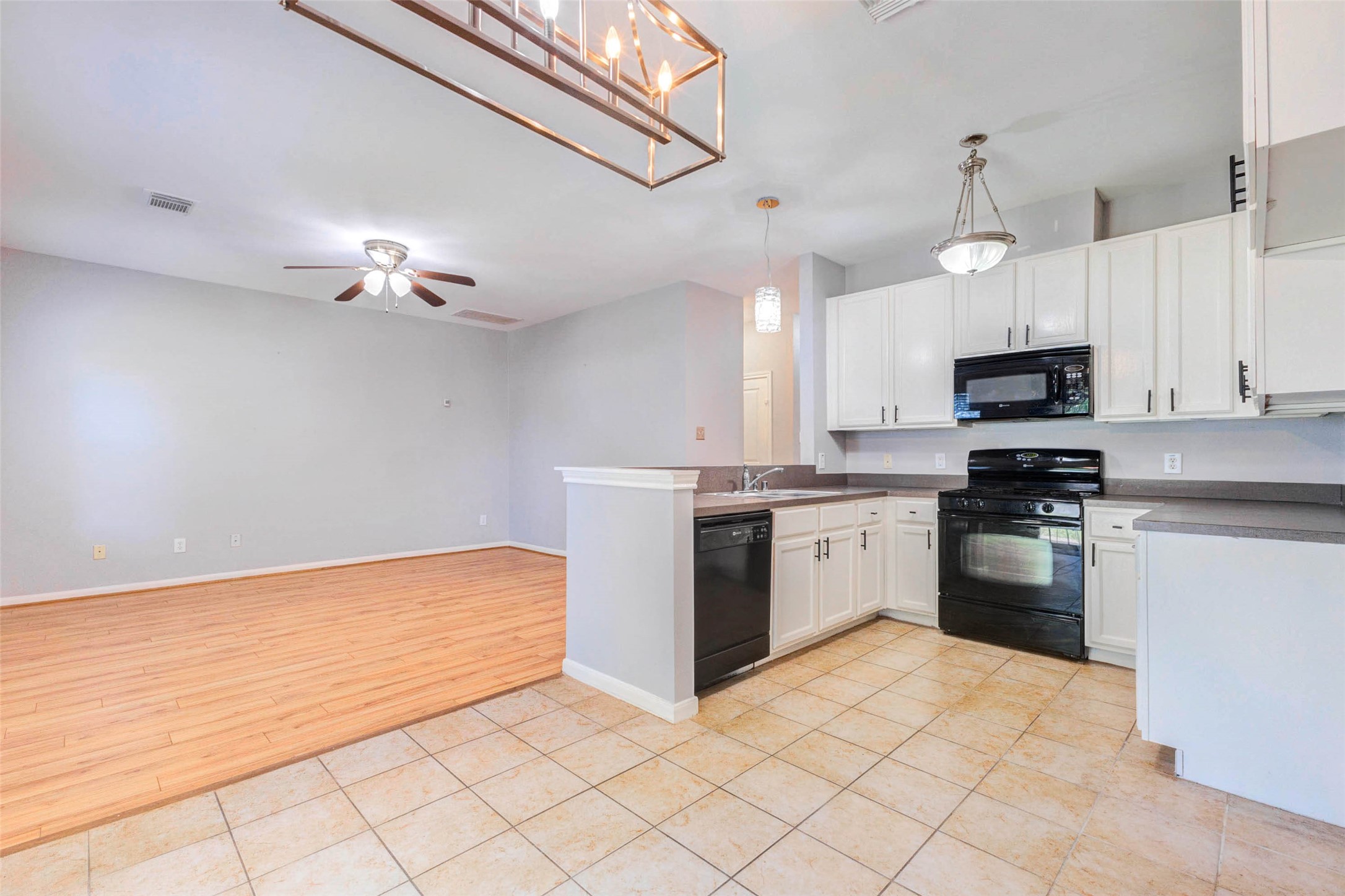 14522 Durham Chase Lane Houston, TX 77095 - Photo 11 of 40 a kitchen with granite countertop white cabinets and stainless steel appliances