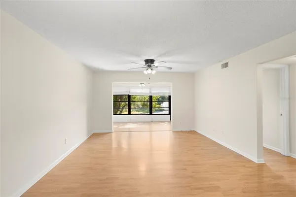a view of an empty room with a window
