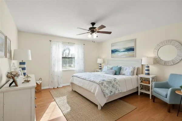 a view of a livingroom with furniture window and wooden floor