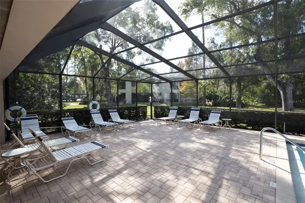 an aerial view of a house with a yard and lake view