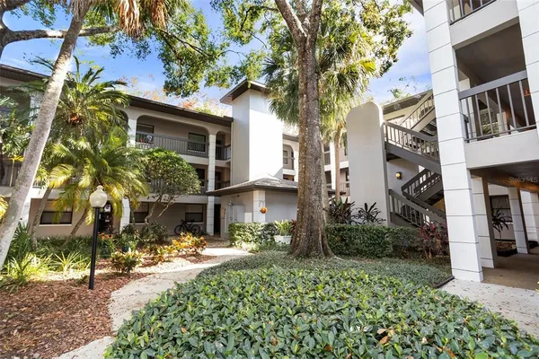 a workspace with wooden floor and a window
