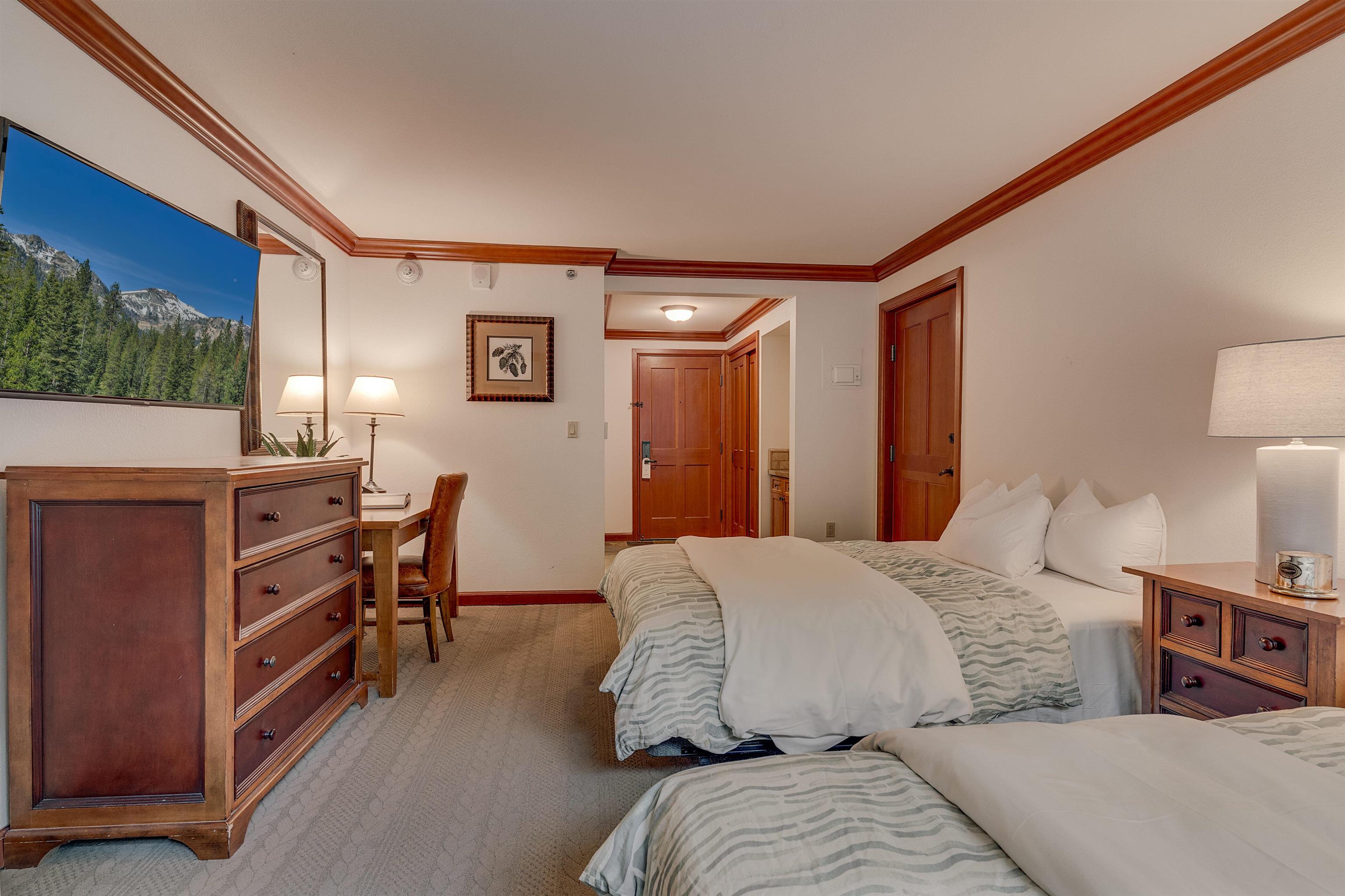 400 Resort Road, Unit 317 319 Olympic Valley, CA 96146 - Photo 11 of 25 a bedroom with a bed and a dresser