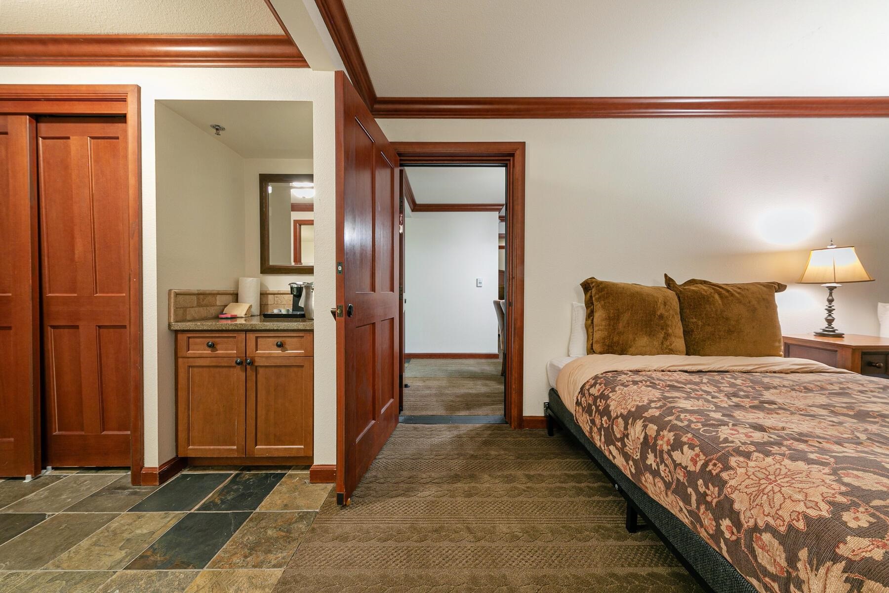 400 Resort Road, Unit 317 319 Olympic Valley, CA 96146 - Photo 14 of 25 a bedroom with a bed and a view of bathroom