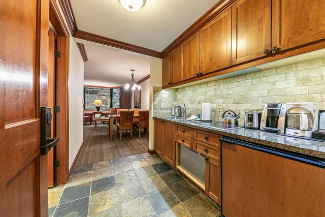 a kitchen with stainless steel appliances granite countertop counter space a sink and cabinets