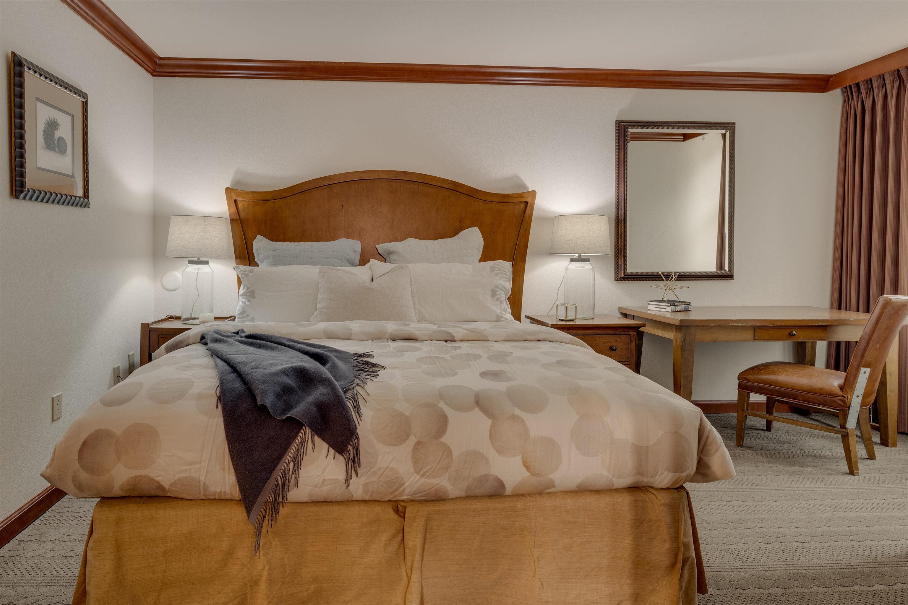 400 Resort Road, Unit 317 319 Olympic Valley, CA 96146 - Photo 9 of 25 a bedroom with a bed and a painting on the wall