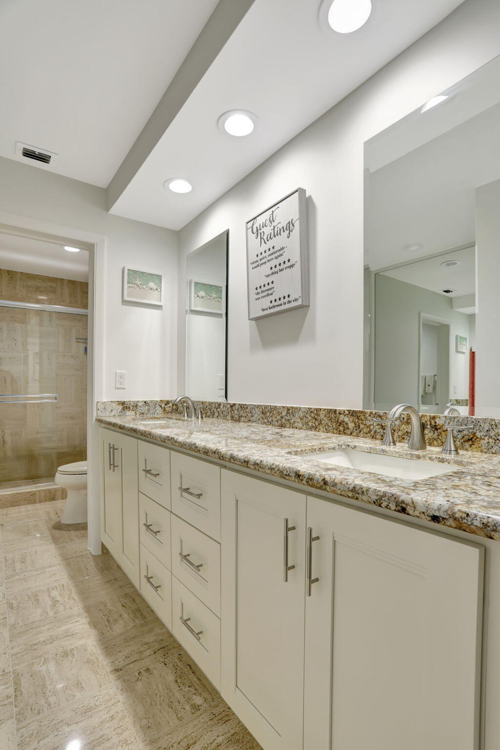 7460 La Paz Boulevard, Unit 108 Boca Raton, FL 33433 - Photo 25 of 40 a bathroom with granite countertop double vanity and a granite