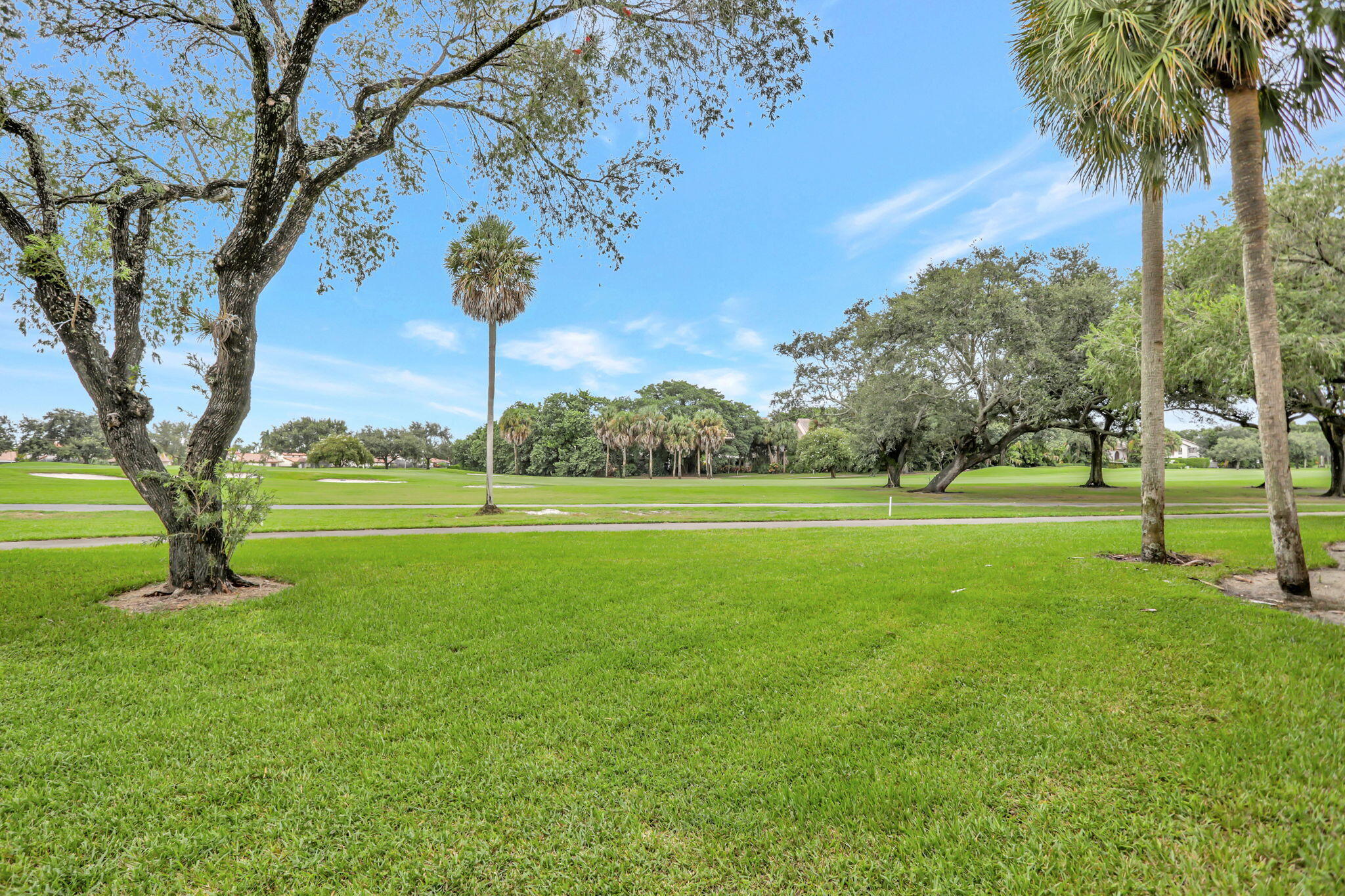 7460 La Paz Boulevard, Unit 108 Boca Raton, FL 33433 - Photo 31 of 40 a view of a park with large trees